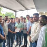 Image Alt Text: A group of Jain Ekta Krantikari Manch Yuva Morcha members submitting a letter to the Khatauli Depot ARM, demanding bus service from Khatauli to Hastinapur, with a backdrop of the historic city of Hastinapur.